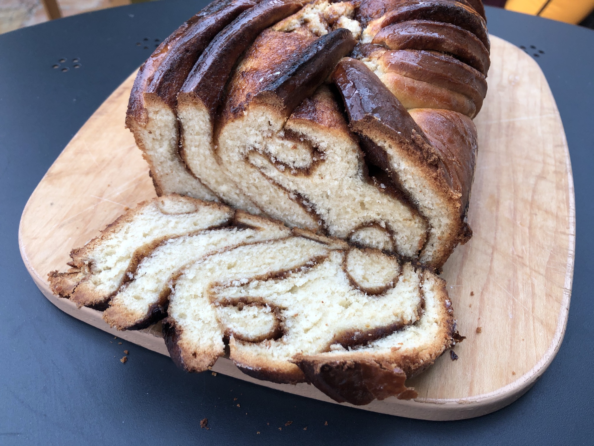 A picture showing a cross section of a babka, showing the swirling, marble like layers.