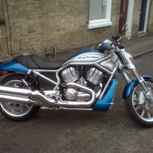 A silver and blue futuristic looking Harley-Davidson