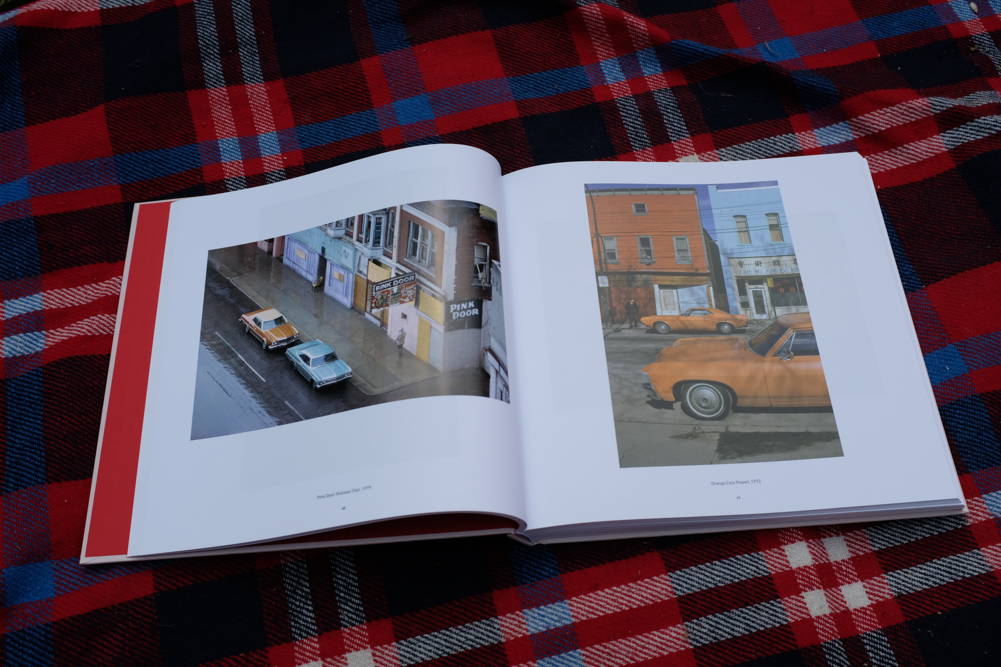 A spread from Modern Color showing some pictures of cars from the 70s in vivid oranges.