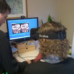 Nick guiding Laura through the Oculus Rift demos.