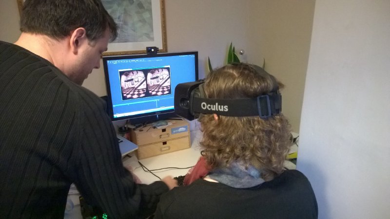 Nick guiding Laura through the Oculus Rift demos.