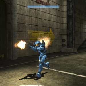 A screenshot of a blue halo spartan firing a rocket launcher whilst running down a corridor.