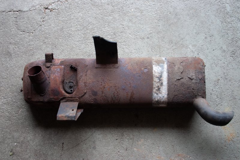 A very rusty tube of metal that is the old stock Buell exhaust.