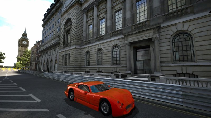 A screenshot of a blocky TVR car racing past some london buildings.