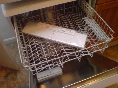 The keyboard is now placed upside down in an otherwise empty dish washer.