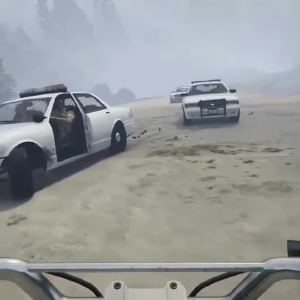 A screen shot of GTA V first person on a beach riding a quad bike head on into two oncoming police vehicles