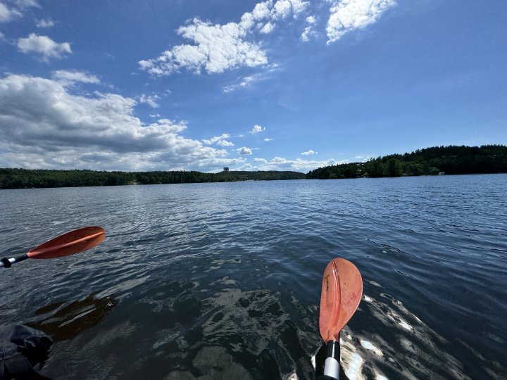 A photo looking along lake Mälaren, with just a couple of oar ends to tell you that we're in the kayak when we took the photo.