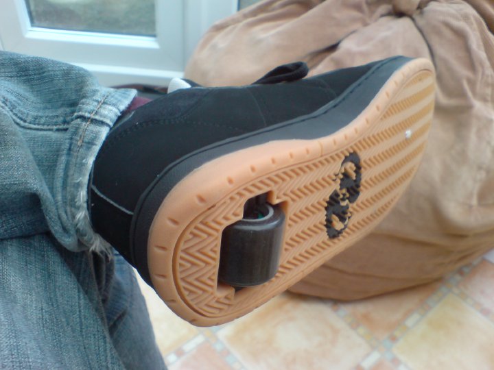 A photo of the underside of my shoe, showing it has a large wheel built into the heel.