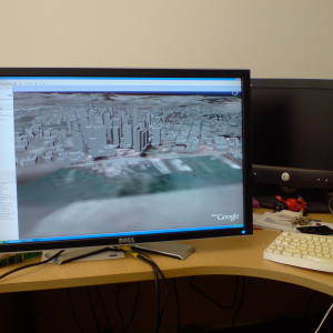 A very large LCD monitor showing Google Earth.