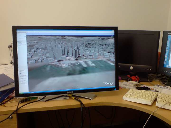 A very large LCD monitor showing Google Earth.