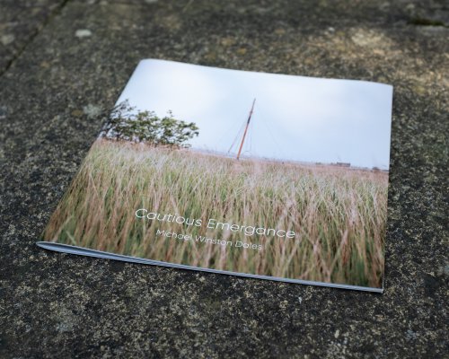 A photo of the cover of the zine, showing a boat mast behind some reeds.